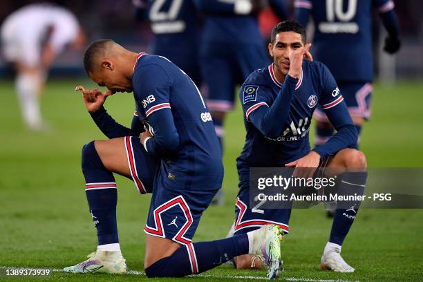 Kylian Mbappe of Paris Saint-Germain celebrates his goal with teammate Achraf Hakim during the Ligue 1 Uber Eats match between Paris Saint Germain...