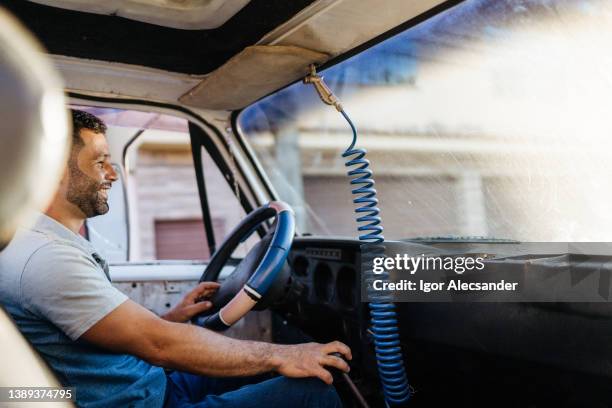 driver in the truck at sunset - convoy of traffic stock pictures, royalty-free photos & images