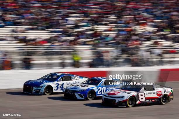 Michael McDowell, driver of the Navage Nasal Care Ford, Christopher Bell, driver of the SiriusXM Toyota, and Tyler Reddick, driver of the Guaranteed...