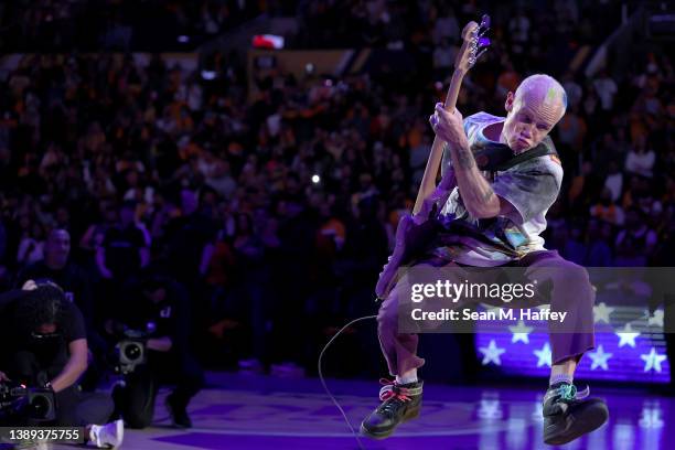 Bass player Flea of the band The Red Hot Chili Peppers plays the national anthem prior to a game between the Los Angeles Lakers and the Denver...