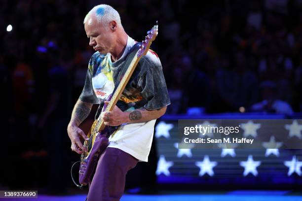 Bass player Flea of the band The Red Hot Chili Peppers plays the national anthem prior to a game between the Los Angeles Lakers and the Denver...