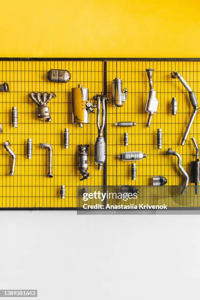 various car parts and accessories on yellow background. - motor ストックフォトと画像