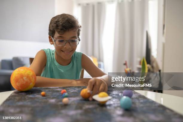 student doing a space and astronomy school work - bright future stock pictures, royalty-free photos & images