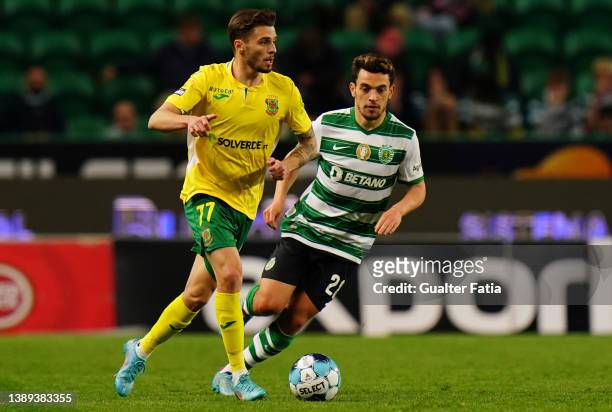 Nuno Santos of FC Pacos de Ferreira with Pedro Goncalves of Sporting CP in action during the Liga Bwin match between Sporting CP and FC Pacos de...