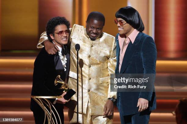 Bruno Mars, Dernst Emile II, and Anderson .Paak accept the Song Of The Year award for ‘Leave The Door Open’ onstage during the 64th Annual GRAMMY...