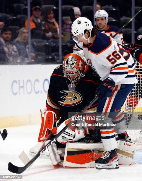 John Gibson of the Anaheim Ducks makes a save in front of Kailer Yamamoto of the Edmonton Oilers in the first period at Honda Center on April 03,...