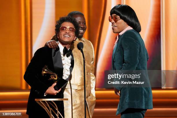 Bruno Mars, Dernst Emile II, and Anderson .Paak accept the Song Of The Year award for ‘Leave The Door Open’ onstage during the 64th Annual GRAMMY...