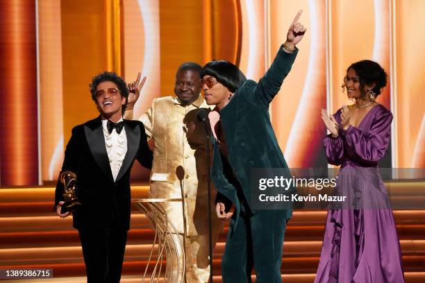 Bruno Mars, Dernst Emile II, and Anderson .Paak accept the Song Of The Year award for ‘Leave The Door Open’ onstage during the 64th Annual GRAMMY...