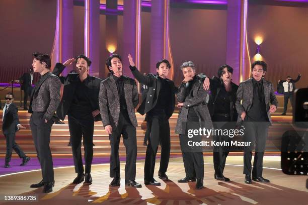 Jimin, J-Hope, Jin, Jungkook, RM, Suga, and V of BTS perform onstage during the 64th Annual GRAMMY Awards at MGM Grand Garden Arena on April 03, 2022...