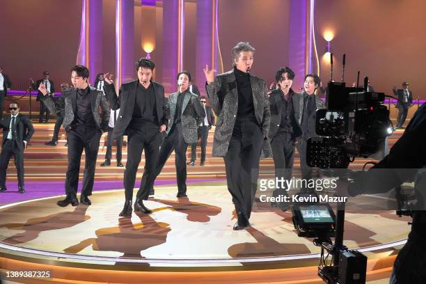 Jimin, J-Hope, Jin, RM, Suga, and V of BTS perform onstage during the 64th Annual GRAMMY Awards at MGM Grand Garden Arena on April 03, 2022 in Las...