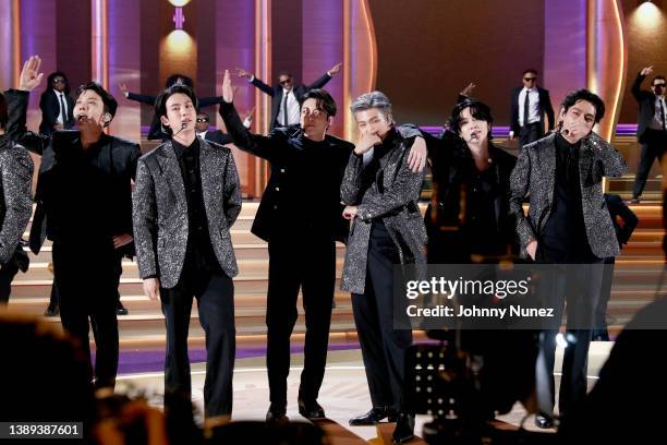 Hope, Jin, Jungkook, RM, Suga and V of BTS perform onstage during the 64th Annual GRAMMY Awards at MGM Grand Garden Arena on April 03, 2022 in Las...