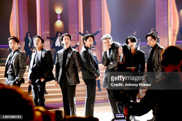 Jimin, J-Hope, Jin, Jungkook, RM, Suga, and V of BTS perform onstage during the 64th Annual GRAMMY Awards at MGM Grand Garden Arena on April 03, 2022...