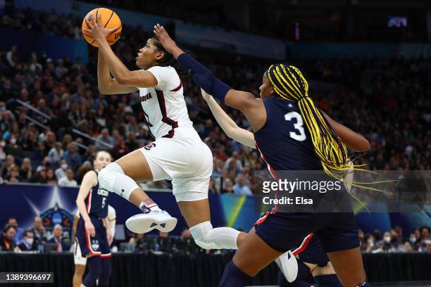 Zia Cooke of the South Carolina Gamecocks goes up for a shot in front of Aaliyah Edwards of the UConn Huskies in the third quarter during the 2022...