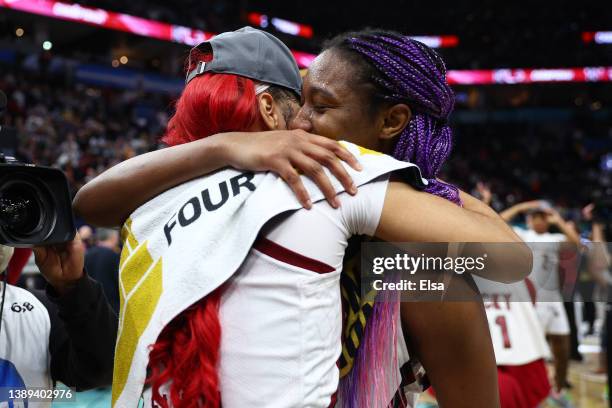 Victaria Saxton of the South Carolina Gamecocks hugs Aliyah Boston after defeating the UConn Huskies 64-49 during the 2022 NCAA Women's Basketball...