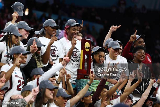 Aliyah Boston and the South Carolina Gamecocks pose with the national championship trophy after defeating the UConn Huskies 64-49 during the 2022...