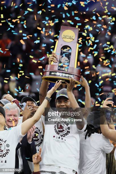 Aliyah Boston of the South Carolina Gamecocks holds up the national championship trophy after defeating the UConn Huskies 64-49 during the 2022 NCAA...