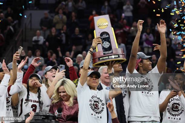 Head coach Dawn Staley of the South Carolina Gamecocks holds up the national championship trophy after defeating the UConn Huskies 64-49 during the...