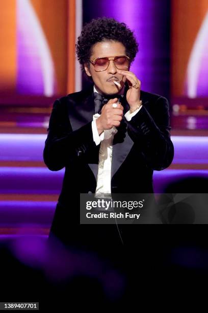 Bruno Mars of Silk Sonic accepts the Record Of The Year award for ‘Leave The Door Open’ onstage during the 64th Annual GRAMMY Awards at MGM Grand...