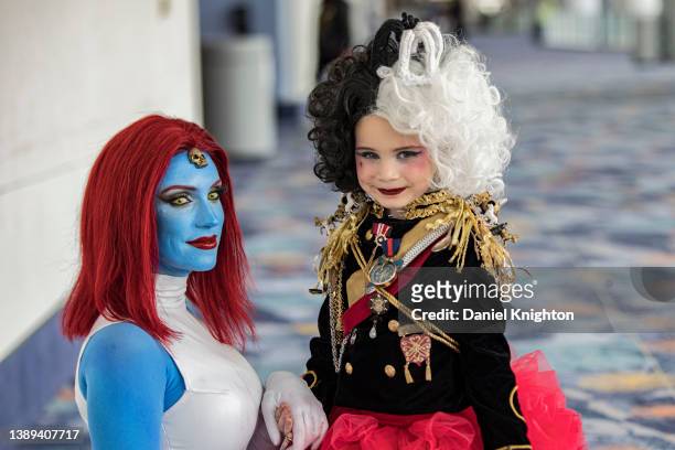 Mother and daughter cosplayer team pose for photos as Mystique and Cruella De Vil at WonderCon 2022 Day 3 at Anaheim Convention Center on April 03,...