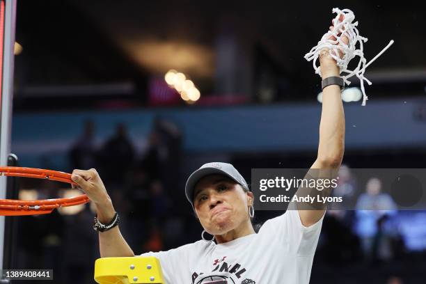 Head coach Dawn Staley of the South Carolina Gamecocks reacts after cutting down the net after defeating the UConn Huskies 64-49 during the 2022 NCAA...