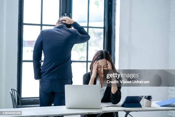 stressed business woman with colleagues,business,teamwork,people and crisis concept. - employee conflict stock pictures, royalty-free photos & images