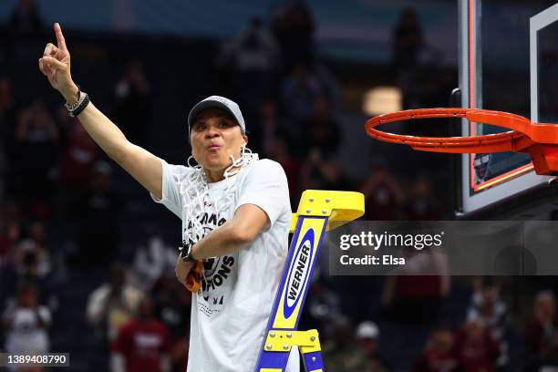 Head coach Dawn Staley of the South Carolina Gamecocks reacts after cutting down the net after defeating the UConn Huskies 64-49 during the 2022 NCAA...