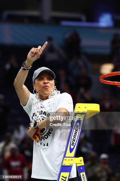 Head coach Dawn Staley of the South Carolina Gamecocks reacts after cutting down the net after defeating the UConn Huskies 64-49 during the 2022 NCAA...