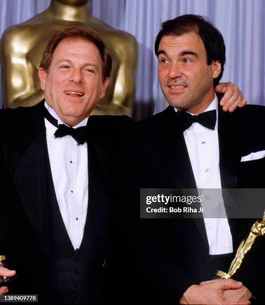 Oscar Winners for Best Picture "Platoon" Director Oliver Stone and Producer Arnold Kopelson, backstage at the Academy Awards Show, March 30, 1987 in...