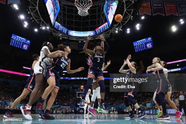 Aaliyah Edwards and Nika Muhl of the UConn Huskies look to rebound the ball in the second half against the South Carolina Gamecocks during the 2022...