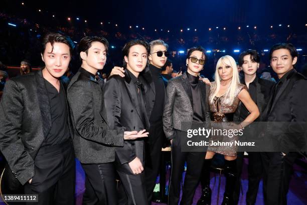 Hope, Jungkook, Jin, RM, Jimin of BTS and Donatella Versace and Suga and V of BTS during the 64th Annual GRAMMY Awards at MGM Grand Garden Arena on...