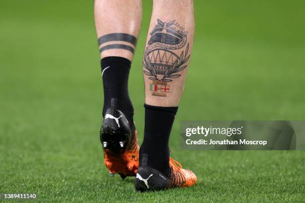 Tattoo on the calf of Alessandro Bastoni of FC Internazionale bearing an image of the San Siro Stadium to celebrate the scudetto victory in 2021 and...