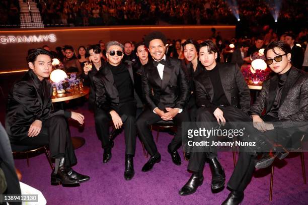 Suga, RM, Jin of BTS and Trevor Noah and J-Hope, Jungkook, and Jimin of BTS onstage during the 64th Annual GRAMMY Awards at MGM Grand Garden Arena on...