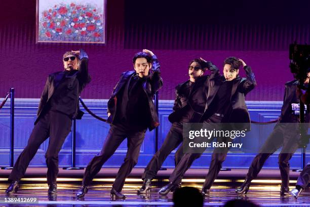 Jimin, and Jungkook of BTS perform onstage during the 64th Annual GRAMMY Awards at MGM Grand Garden Arena on April 03, 2022 in Las Vegas, Nevada.