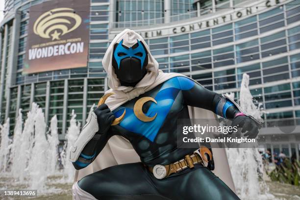 Cosplayer Derek Shackelton as MoonWing, a Moon Knight/Nightwing mashup poses for photos at WonderCon 2022 Day 3 at Anaheim Convention Center on April...
