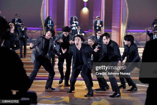 Jimin, Jin, V, J-Hope, RM, Jungkook, and Suga of BTS perform onstage during the 64th Annual GRAMMY Awards at MGM Grand Garden Arena on April 03, 2022...