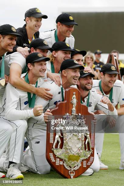 Shaun Marsh of Western Australia celebrates with the team and the Sheffield Shield after defeating Victoria during day five of the Sheffield Shield...