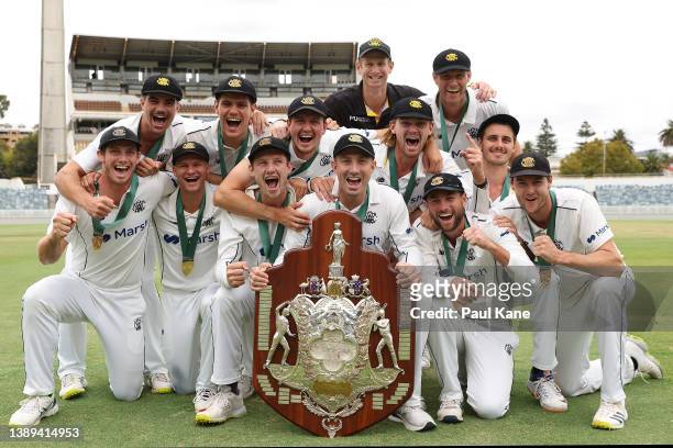 Western Australia pose with the Sheffield Shield after claiming victory during day five of the Sheffield Shield Final match between Western Australia...