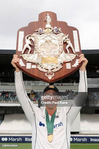 Shaun Marsh of Western Australia hold the Sheffield Shield aloft after claiming victory during day five of the Sheffield Shield Final match between...