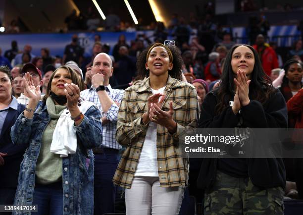 Candace Parker spotted at NCAA Women’s Championship game in adidas ‘More Is Possible’ tee with Natalie Achonwa, National Championship players and...