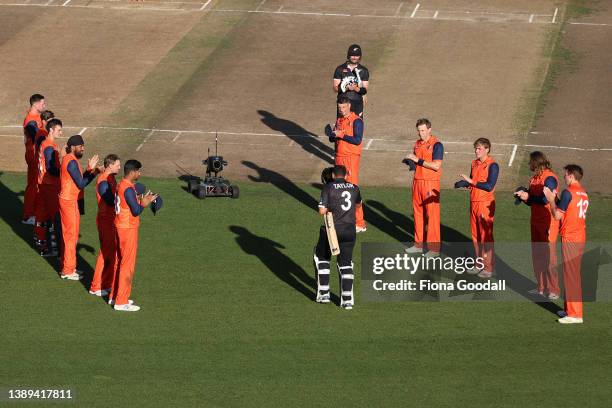 The Netherlands team form a guard of honour as Ross Taylor of New Zealand walks out to bat in his last game for New Zealanduring the third and final...