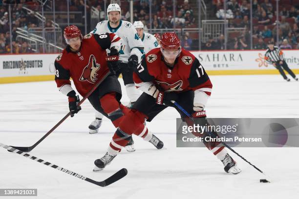 Alex Galchenyuk of the Arizona Coyotes skates with the puck during the first period of the NHL game at Gila River Arena on March 30, 2022 in...