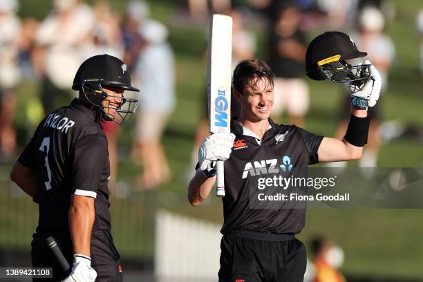 Will Young of New Zealand celebrates 100 runs with Ross Taylor during the third and final one-day international cricket match between the New Zealand...