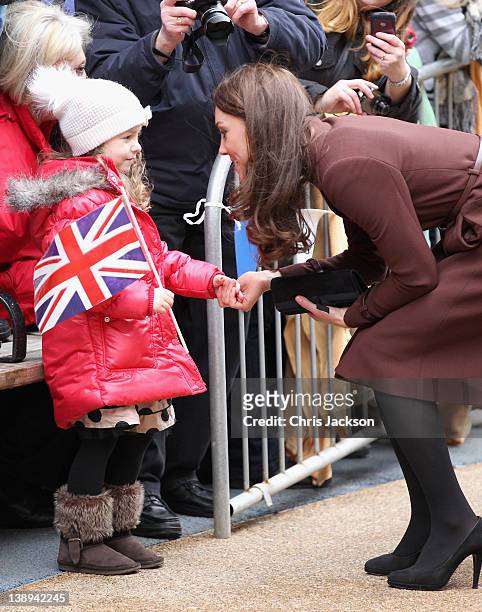 Catherine, Duchess of Cambridge meets a young girl as she visits Alder Hey Children's NHS Foundation Trust on February 14, 2012 in Liverpool,...