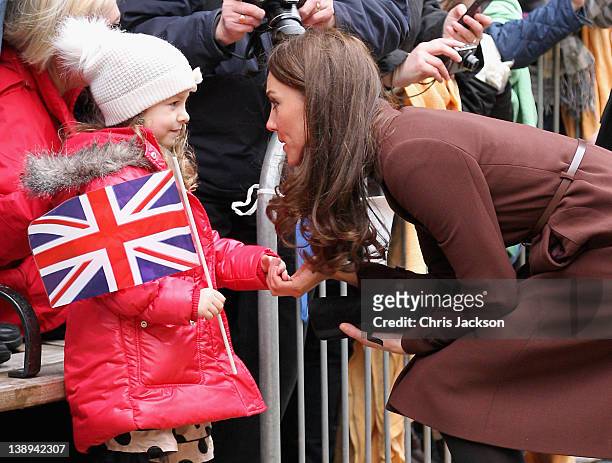 Catherine, Duchess of Cambridge meets a young girl as she visits Alder Hey Children's NHS Foundation Trust on February 14, 2012 in Liverpool,...