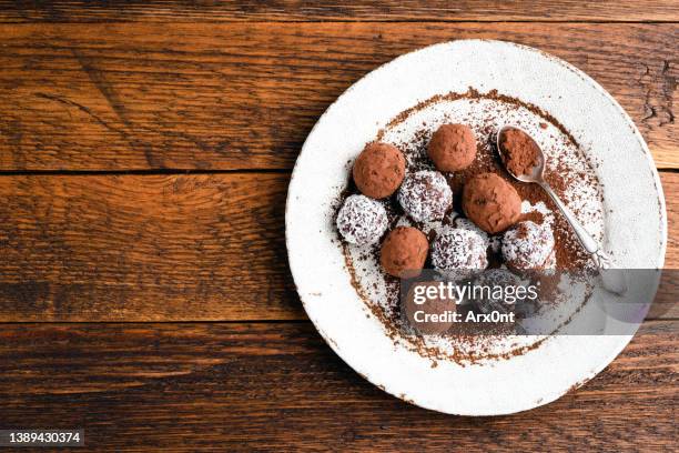 vegan chocolate truffles on plate - candy dish stock pictures, royalty-free photos & images