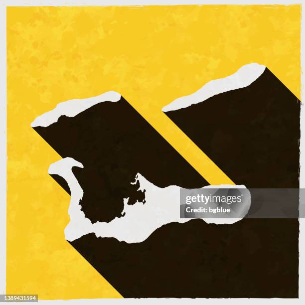 cayman islands map with long shadow on textured yellow background - cayman island map stock illustrations