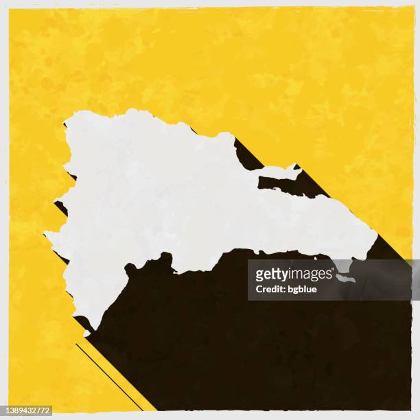 dominican republic map with long shadow on textured yellow background - santo domingo stock illustrations