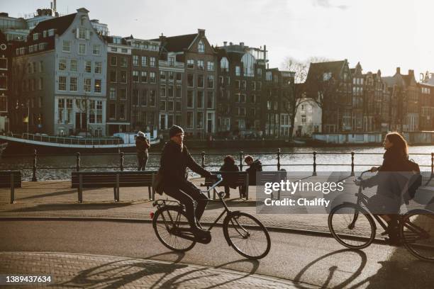 green way of transportation in amsterdam - amsterdam business stock pictures, royalty-free photos & images