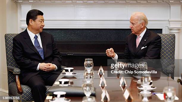 Vice President Joe Biden and Chinese Vice President Xi Jinping talk during an expanded bilateral meeting with other U.S. And Chinese officials in the...