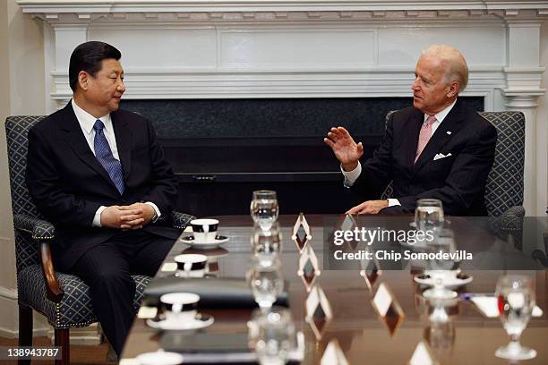 Vice President Joe Biden and Chinese Vice President Xi Jinping talk during an expanded bilateral meeting with other U.S. And Chinese officials in the...